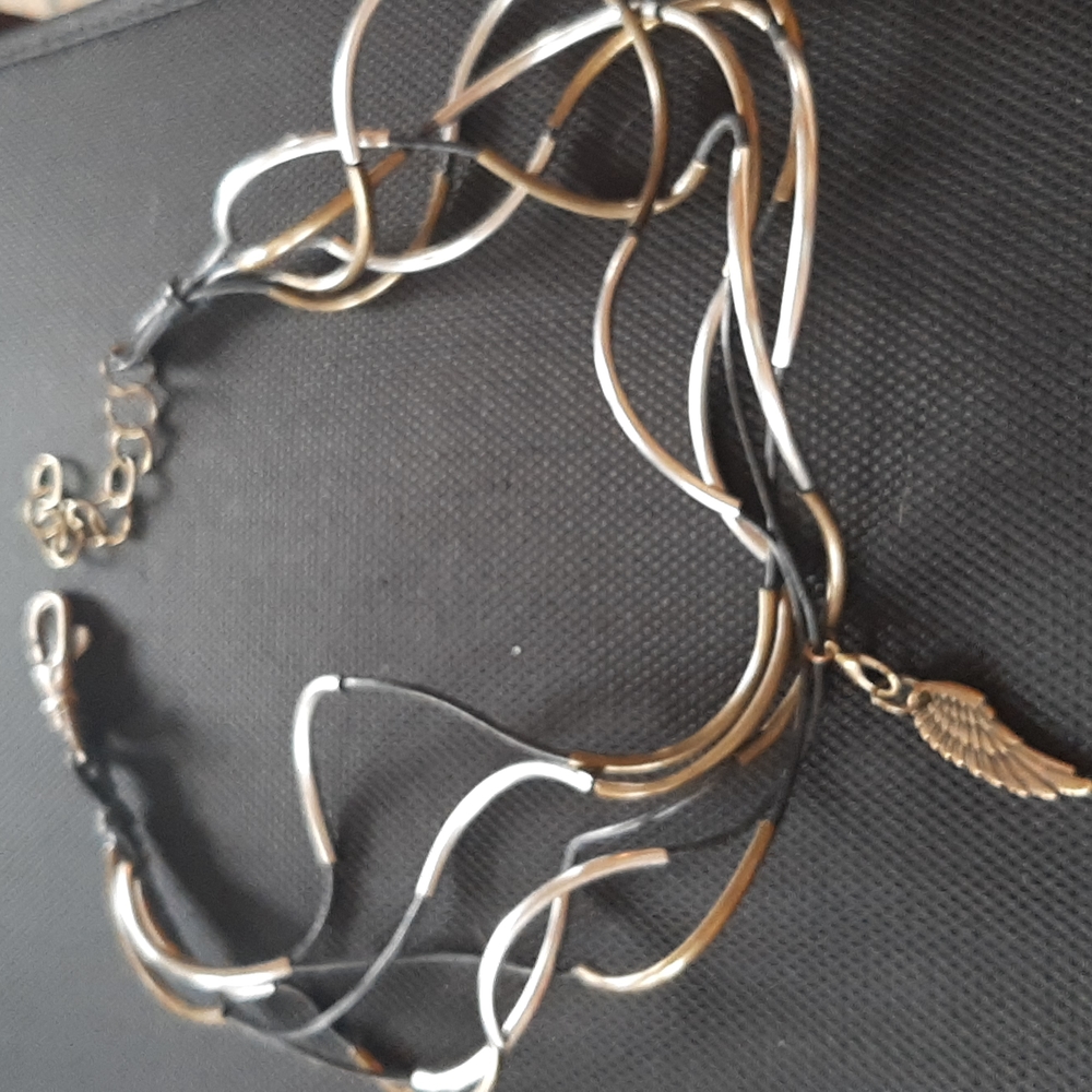 Leather Cord and curved metal Wrap Around Bracelet.